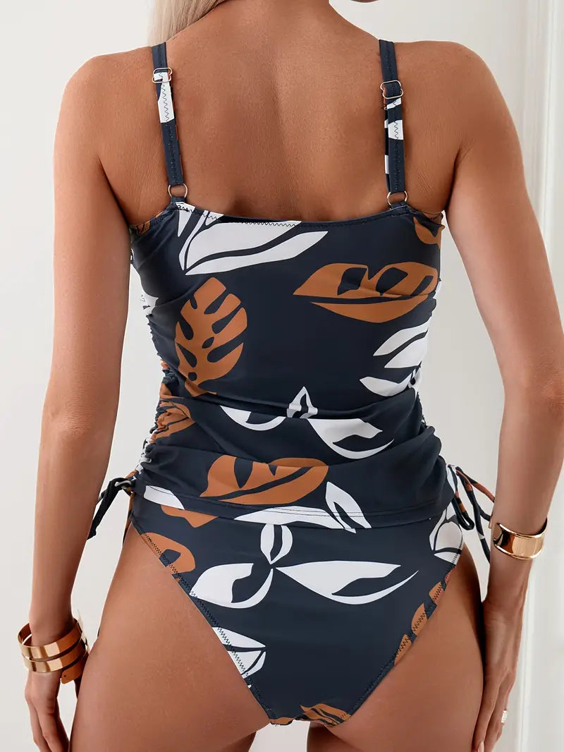 Close-up of women's patterned tankini top with adjustable straps, perfect summer swimwear.