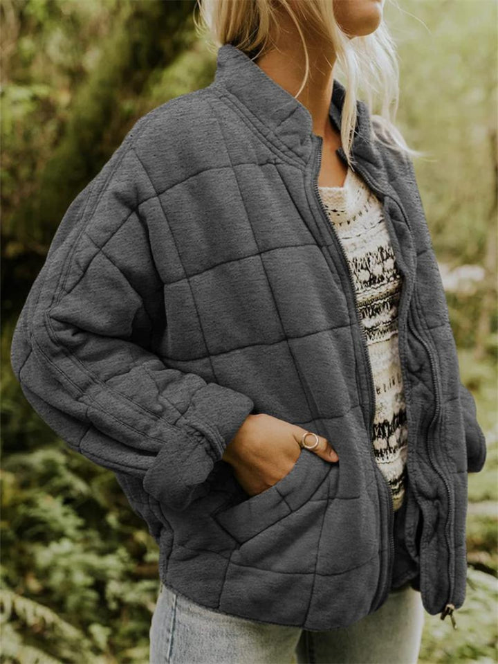 Women's stylish quilted bomber jacket with zip-up front, perfect for casual autumn layering.