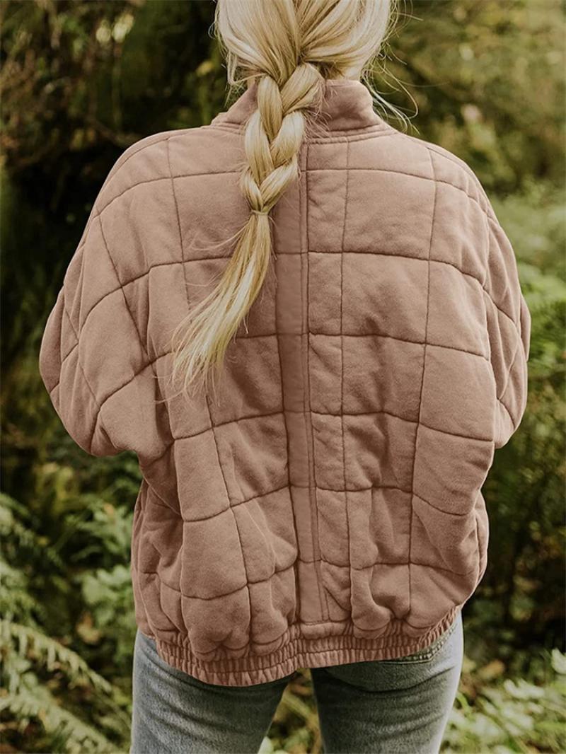 Fashionable women's quilted bomber jacket. Zip-up, with stand collar, perfect for everyday autumn and spring layering.