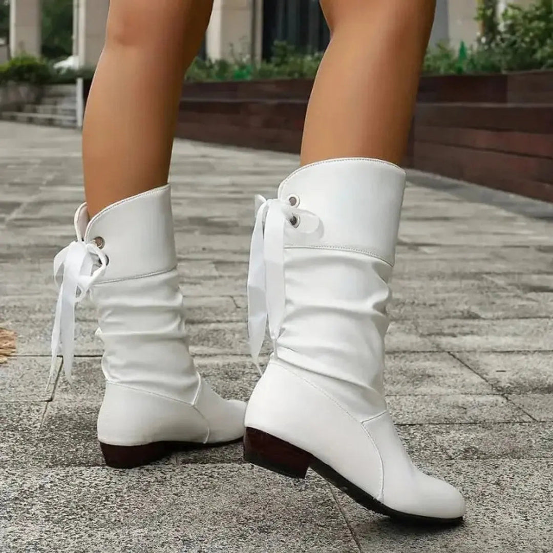 Modern women's fashion mid-calf boots, ruched, lace-up closure, comfortable block heel.