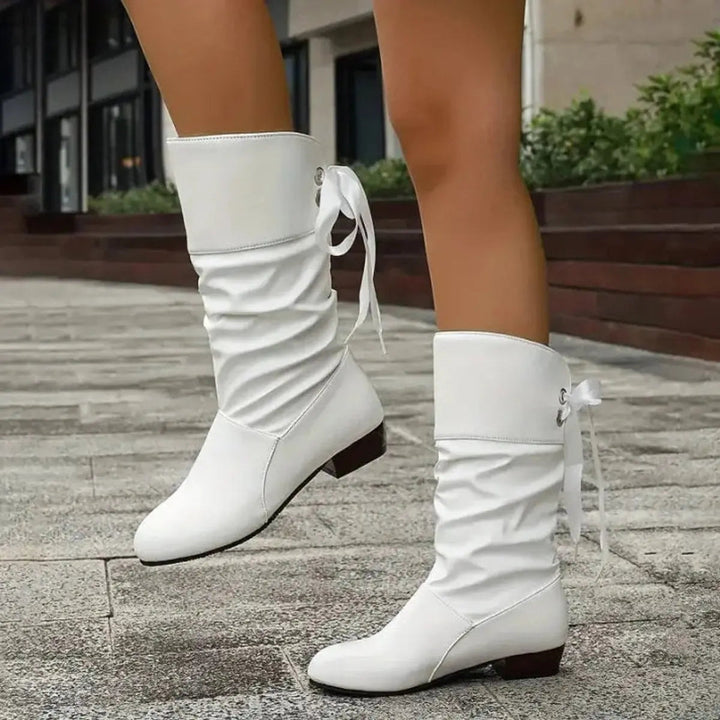 Stylish women's ruched lace-up mid-calf boots, perfect for everyday comfort.