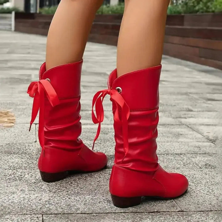 Walk in comfort with these women's ruched mid-calf boots, featuring lace-up & block heel.