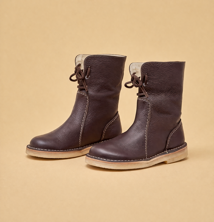 Protective women's warm short snow boots, designed for winter, cold weather, and outdoor activities.