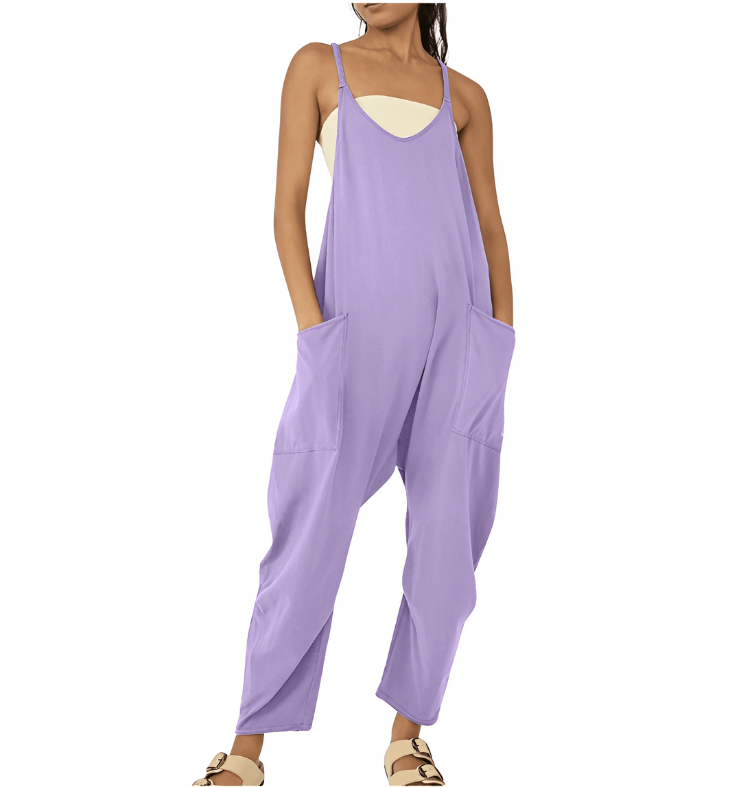 Side view: women's sleeveless jumpsuit, highlighting pockets and relaxed, comfortable fit.