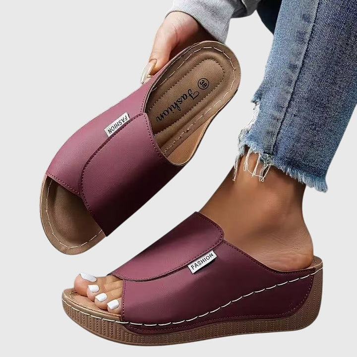 Women's stylish stitched wedge sandals, perfect for summer comfort & fashion.