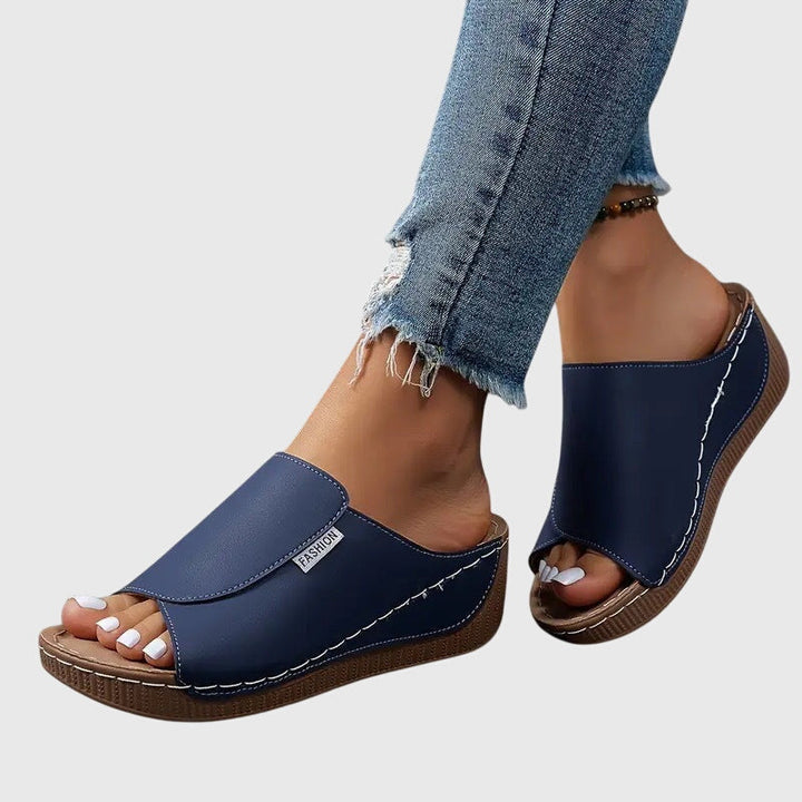 Stylish women's stitched wedge sandals, ideal casual footwear for comfortable everyday wear.