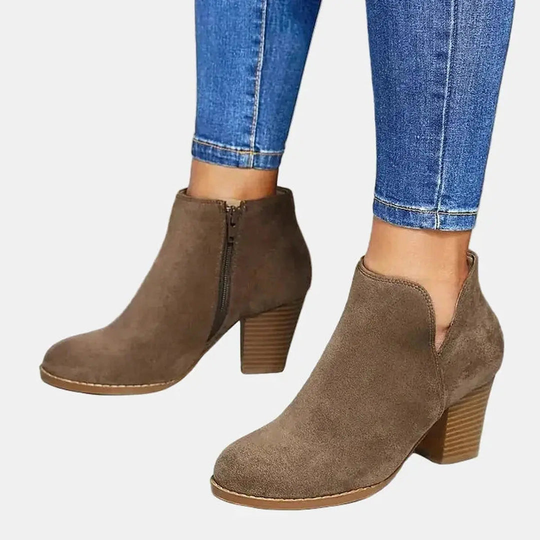 Women's stylish suede block heel ankle boots with a convenient side zip closure.