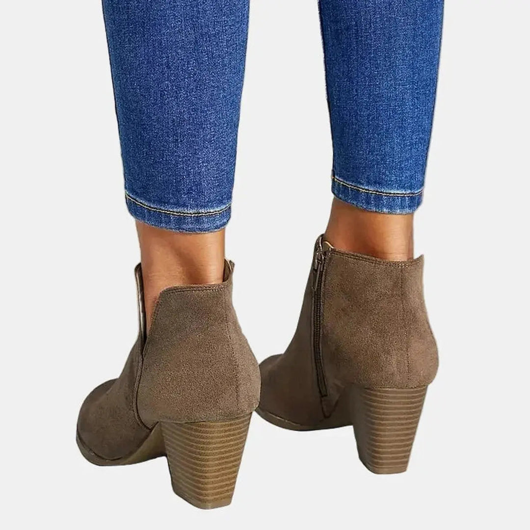Versatile women's suede heeled ankle boots, ideal for casual or fashion looks, with a block heel.