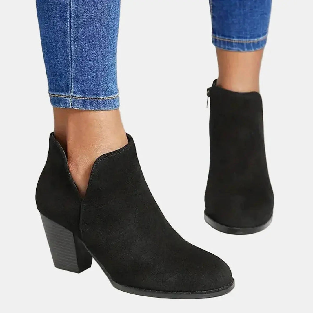 Elegant women's suede ankle boots, showcasing a comfortable block heel and practical side zip design.