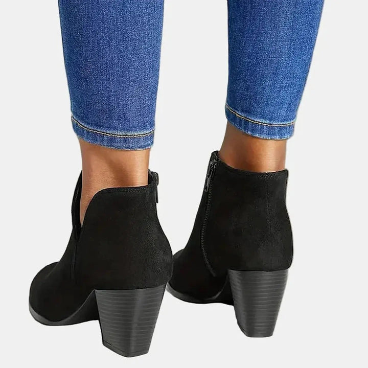 Fashionable women's suede block heel ankle boots with a chic side zip, perfect for versatile footwear.