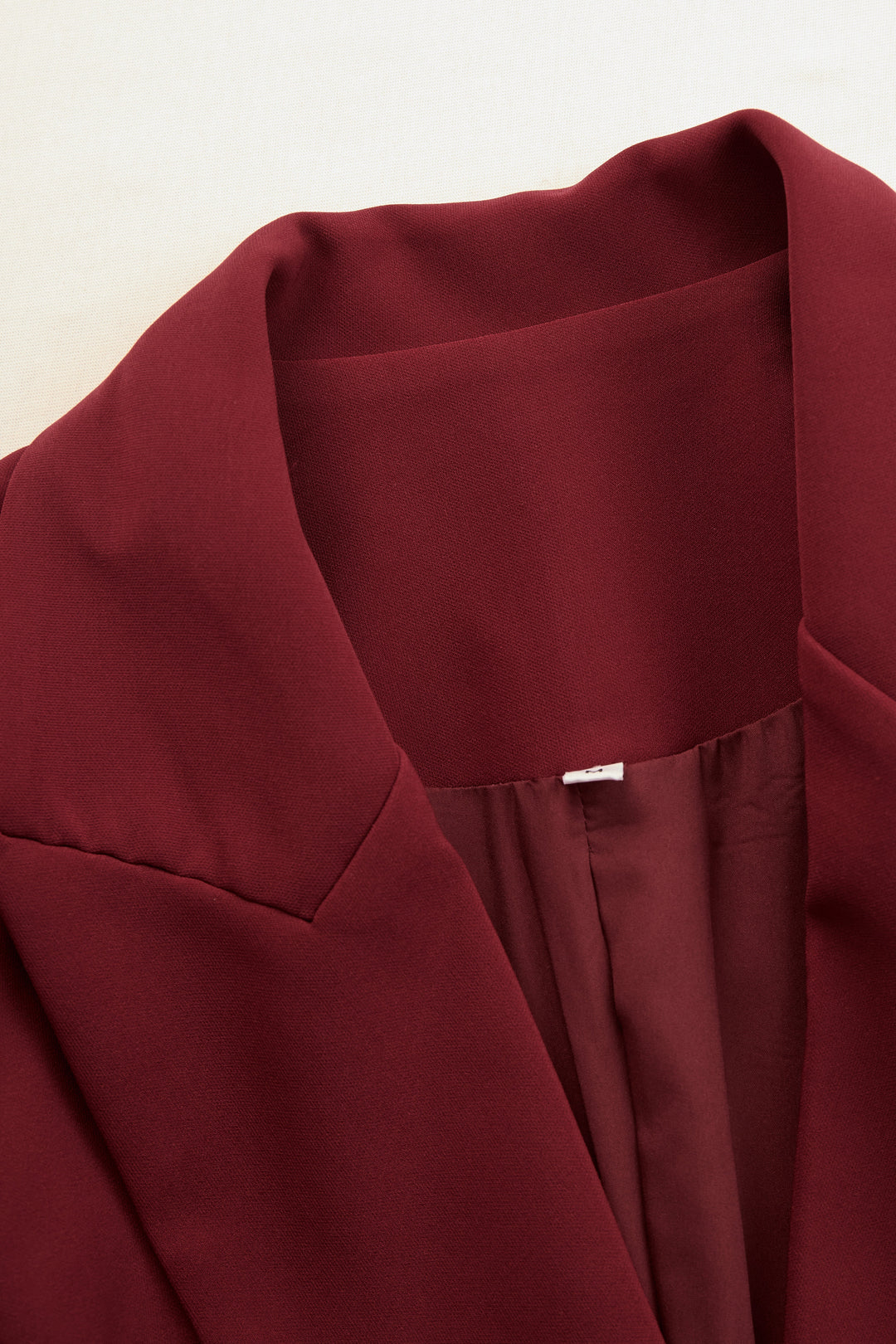 Elegant women's V-neck tailored blazer dress, ideal for office and professional events.