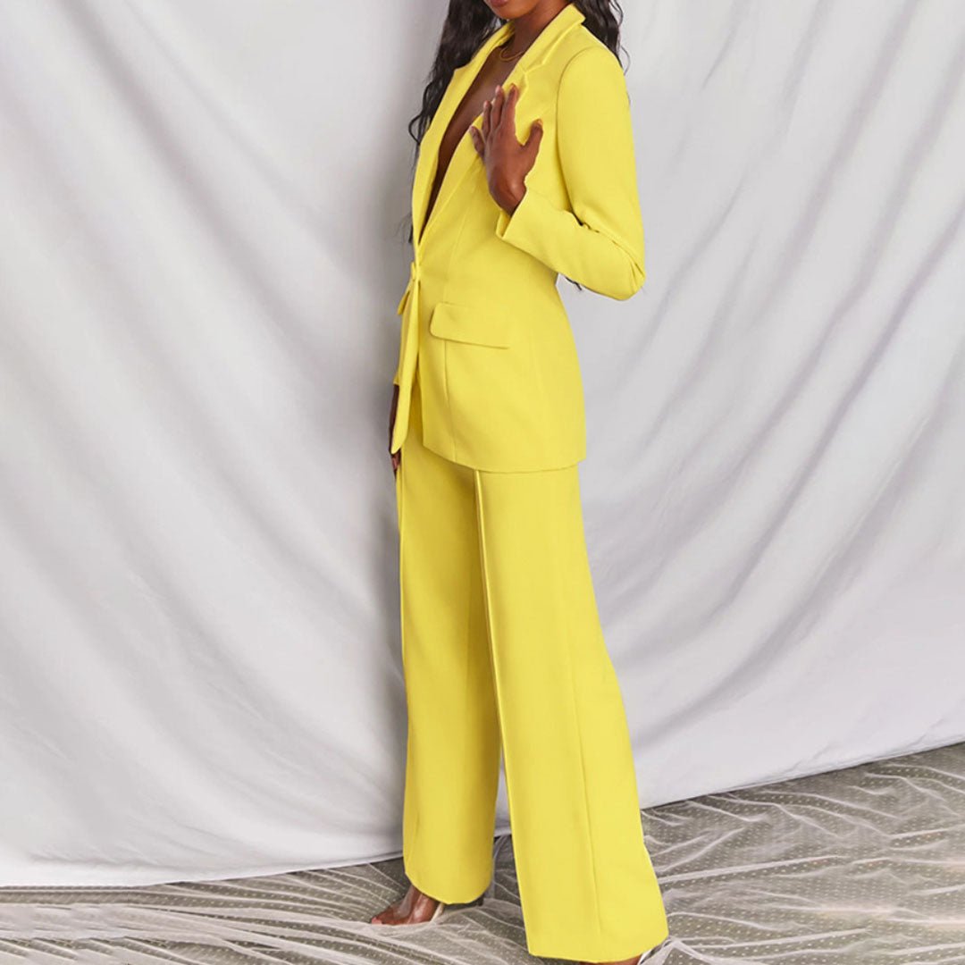 Fashionable women's coordinated outfit: stylish blazer & smart trousers for a sharp look.