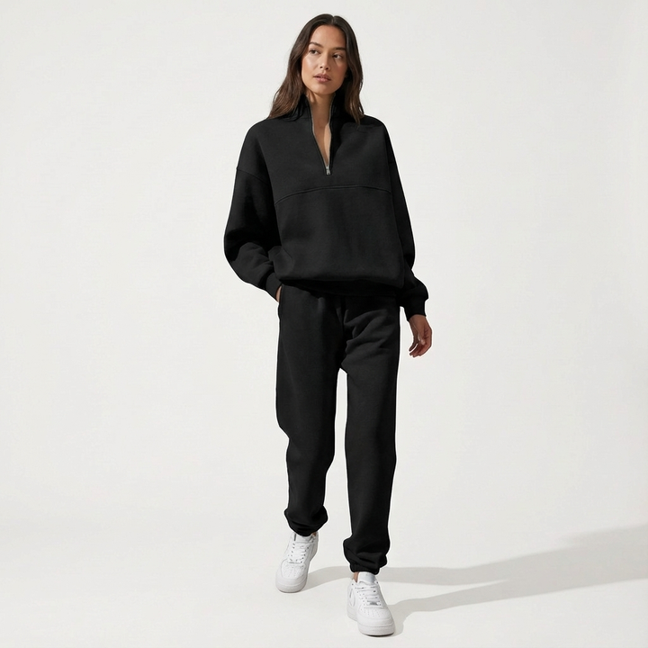 Women's stylish two-piece half-zip tracksuit set with comfortable joggers, ideal for loungewear.