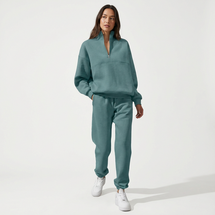Cozy women's two-piece loungewear set featuring a half-zip top and matching jogger pants.