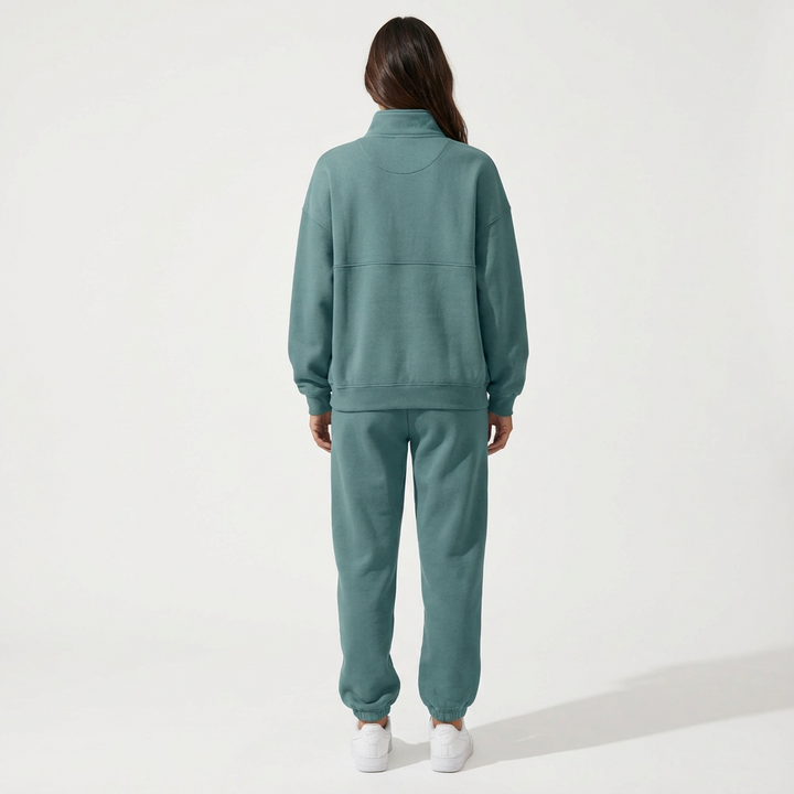 Versatile women's two-piece tracksuit. Half-zip top & jogger bottoms, great for loungewear or activewear.