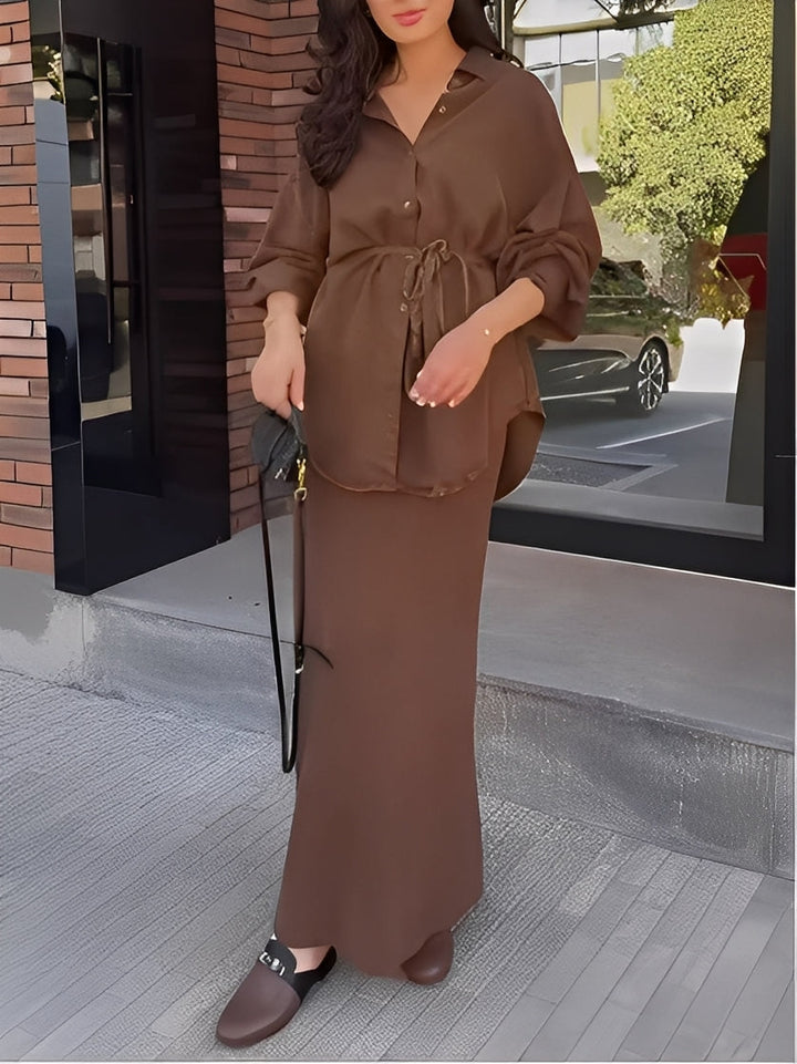 Chic women's two-piece set featuring a modern button shirt and a flowing maxi skirt. Versatile fashion ensemble.