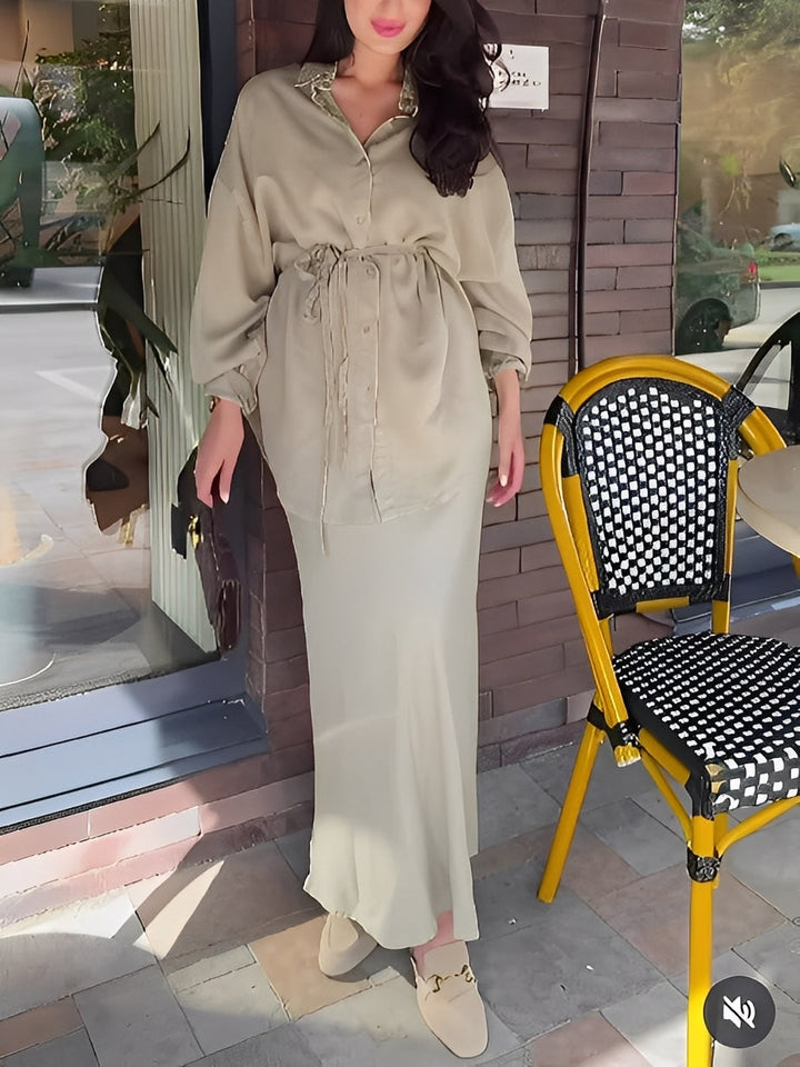 Women's long sleeve button shirt and tie-waist maxi skirt set. Stylish coordinated outfit for casual chic elegance.