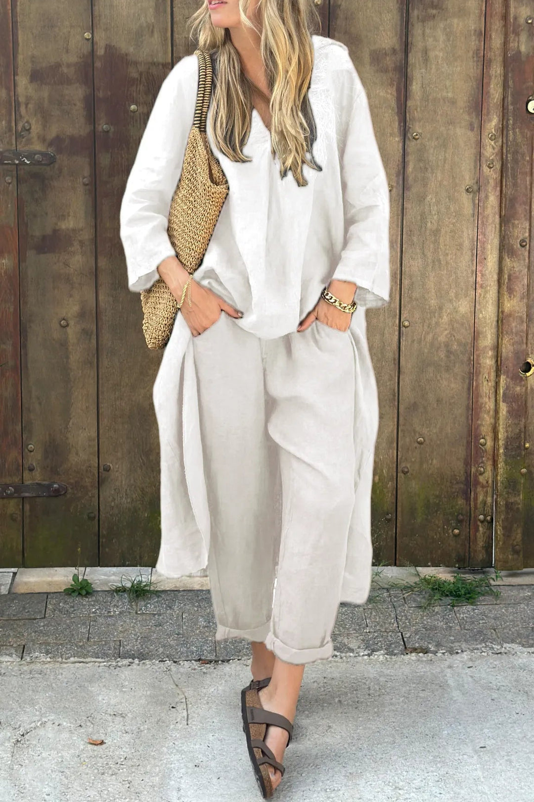 Comfortable & stylish women's two-piece outfit with a breezy top and elegant trousers, perfect for summer fashion.