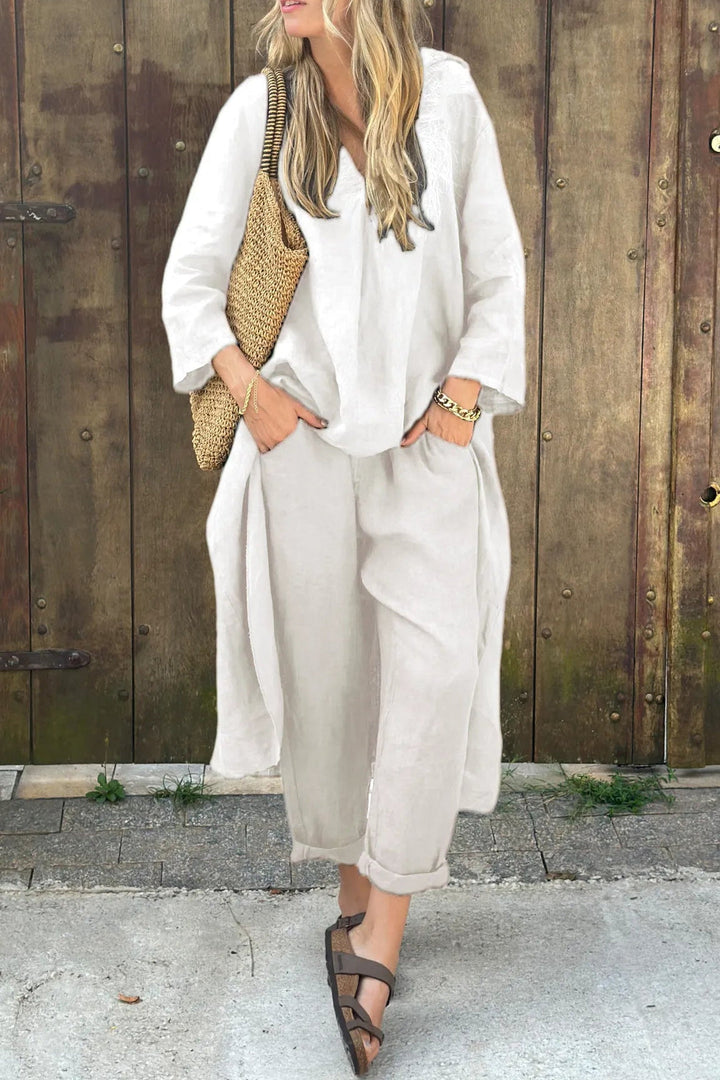 Comfortable & stylish women's two-piece outfit with a breezy top and elegant trousers, perfect for summer fashion.