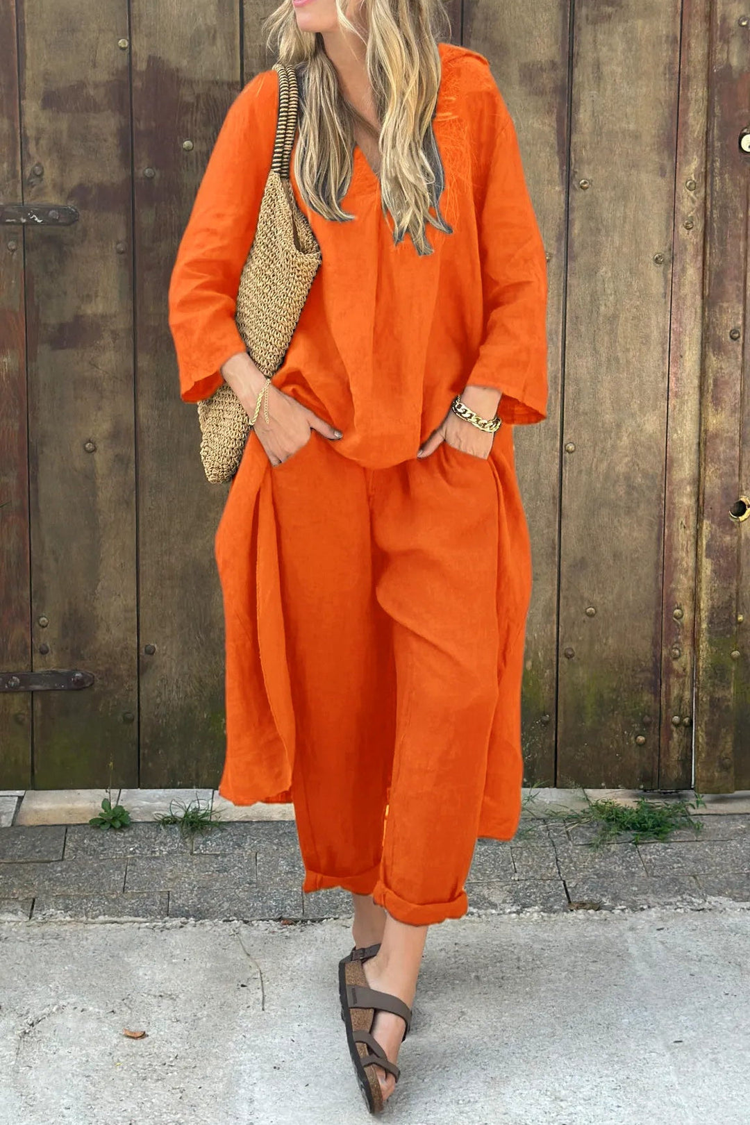 Women's two-piece summer set, featuring a breezy top & elegant trousers. Stylish, comfortable & versatile spring fashion.