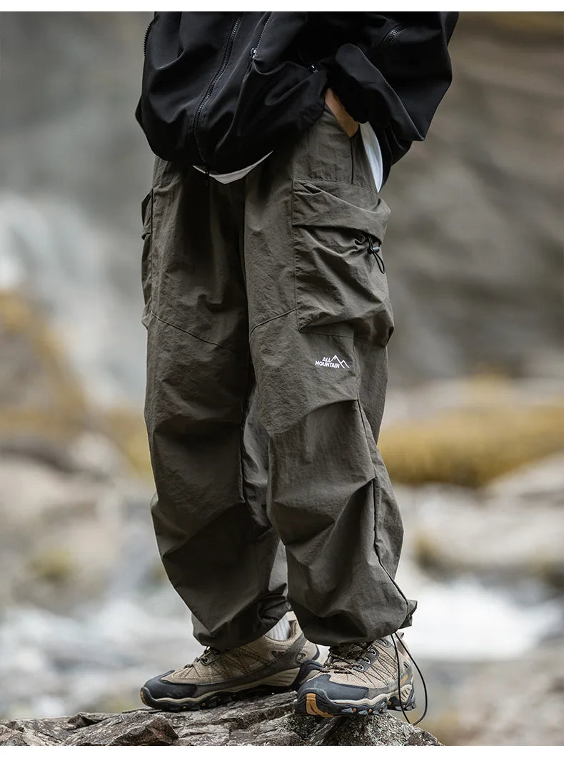 Detail shot of secure zippered pockets on women's stylish waterproof outdoor pants.