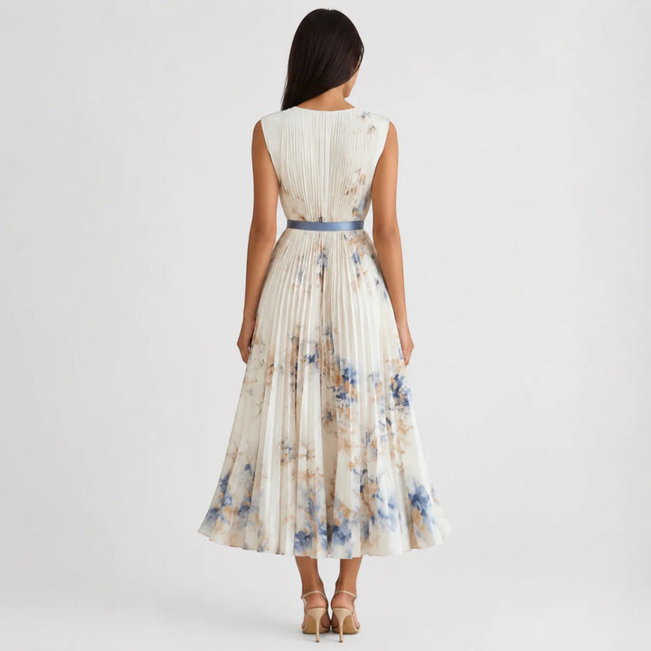 Pleated A-Line women's midi dress, vibrant floral pattern, sleeveless summer style.