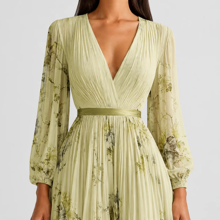 Vacation-ready women's floral pleated midi dress, A-line cut, V-neck for summer fun.