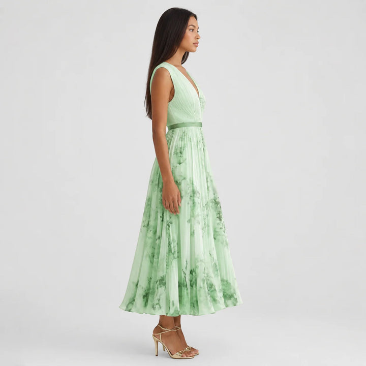 Pleated A-line women's floral midi dress, sophisticated summer style with a V-neck.