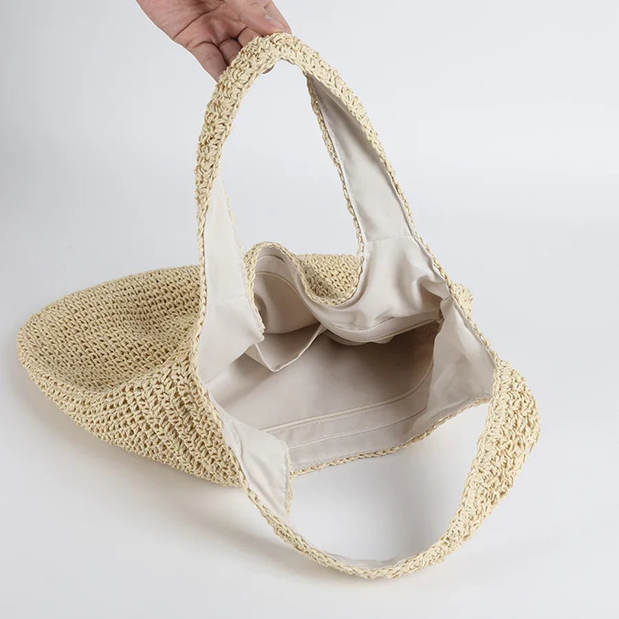 Handwoven straw women's bag, versatile casual shoulder bag for summer beach trips and everyday fashion.