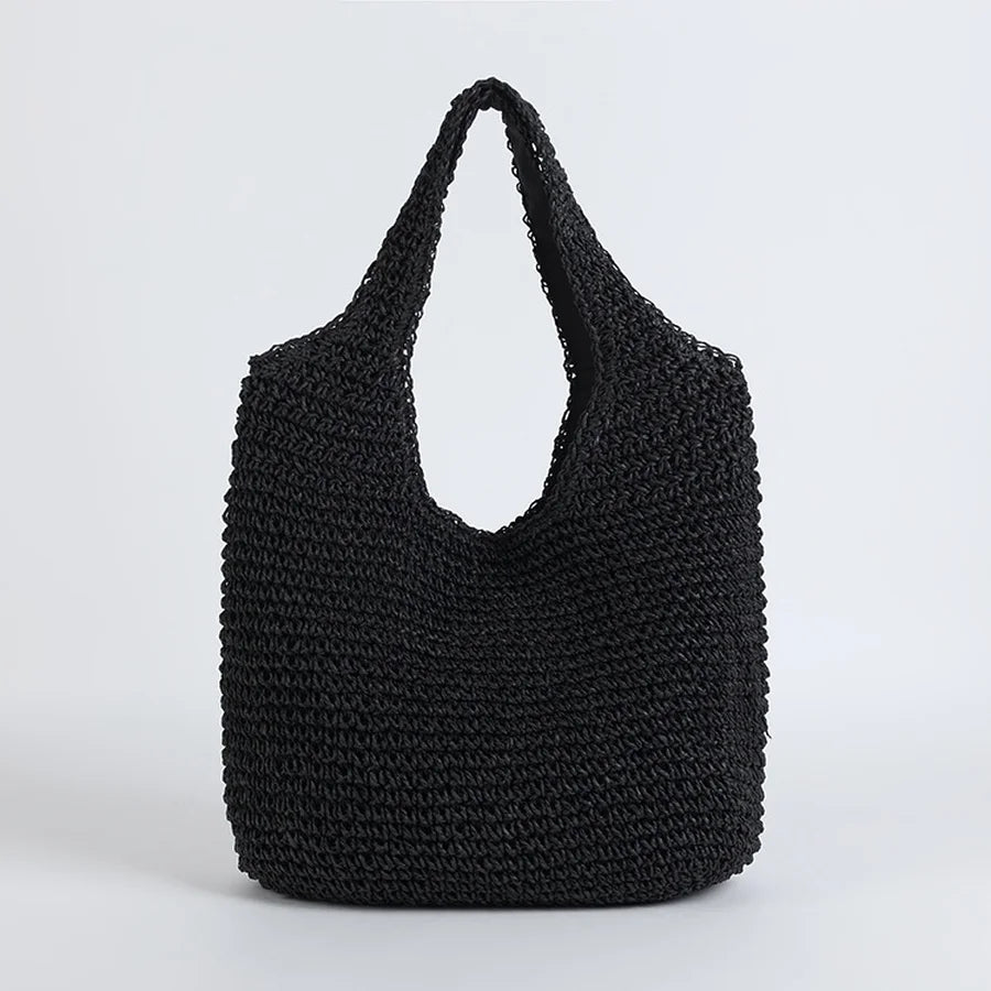 Lightweight straw hobo beach bag with sturdy shoulder strap, a must-have women's summer vacation accessory.