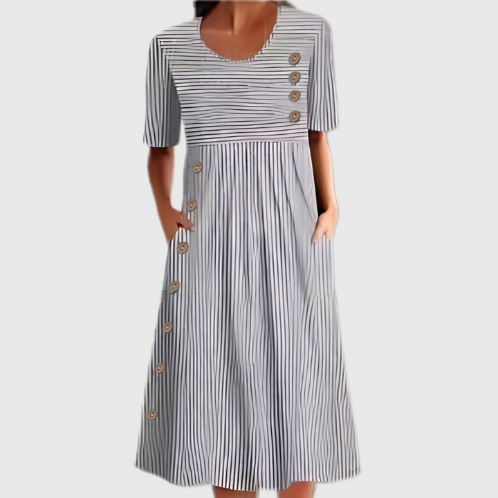 Flattering women's striped midi dress, perfect for summer casual wear or stylish office fashion. Button details.