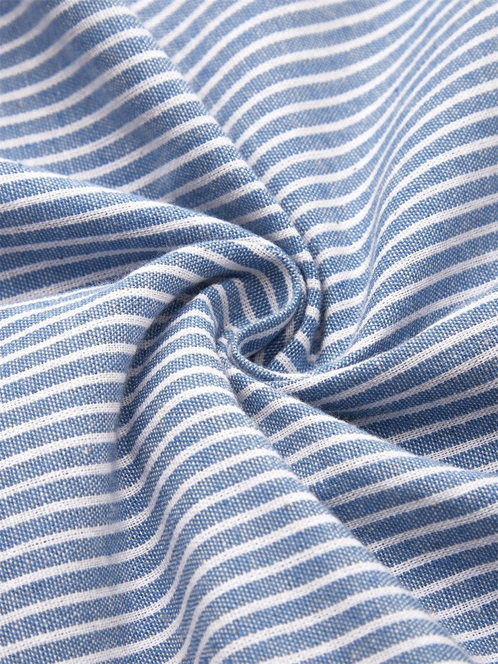 Effortless women's striped midi dress with chic 3/4 sleeves & decorative buttons. Versatile summer style.
