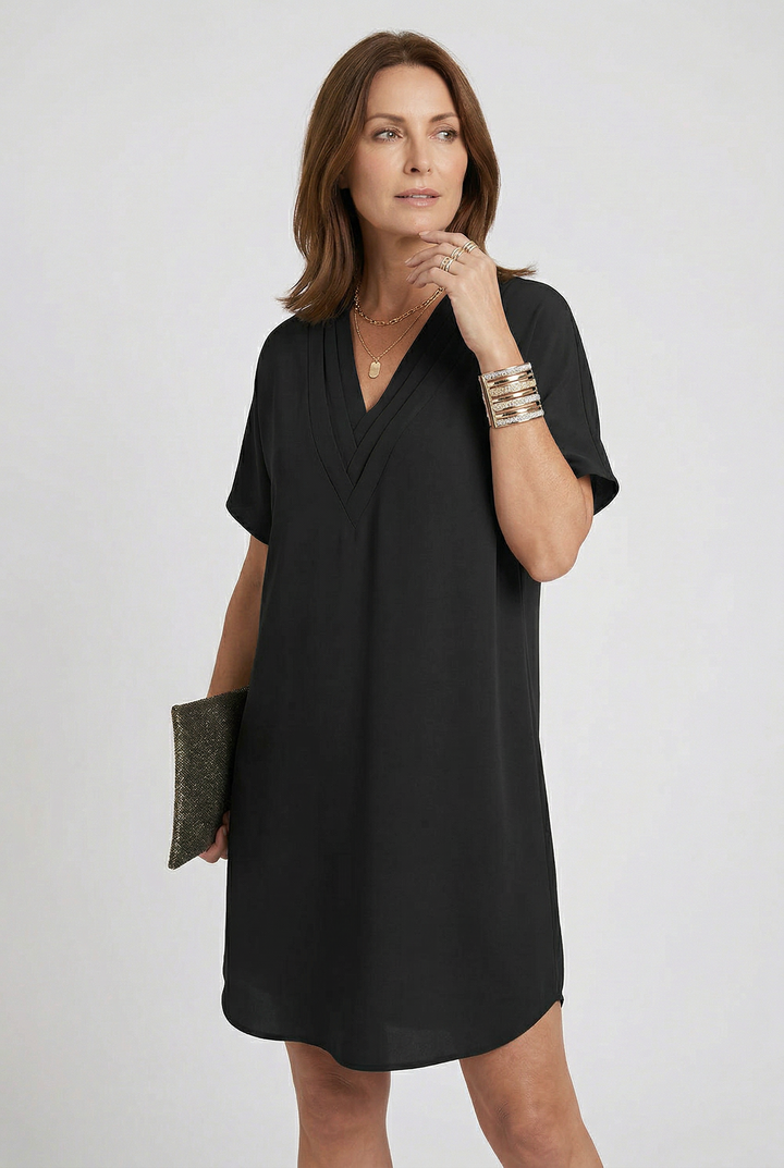 Chic women's V-neck mini dress. Flowy short sleeve summer dress, comfortable and stylish for any occasion.