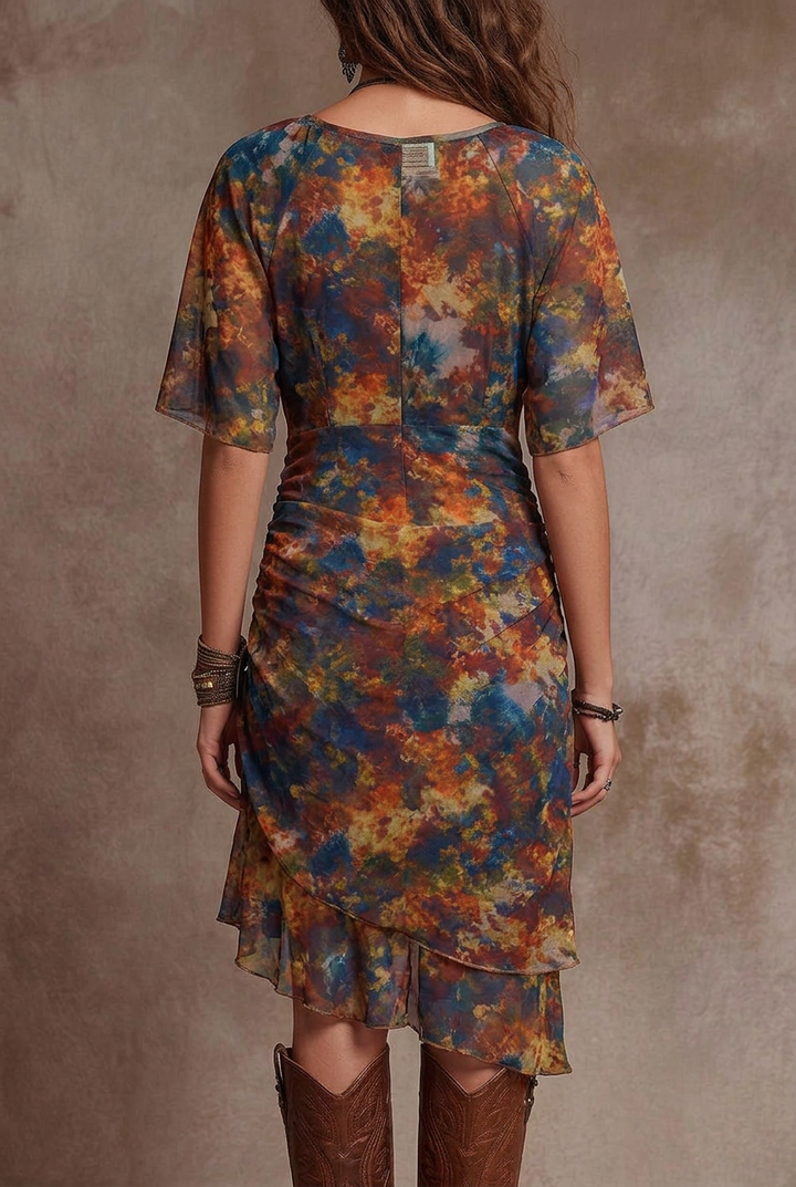 Elegant women's midi dress with a unique sunset print, ruched bodice, & chic asymmetric hem for a boho look.