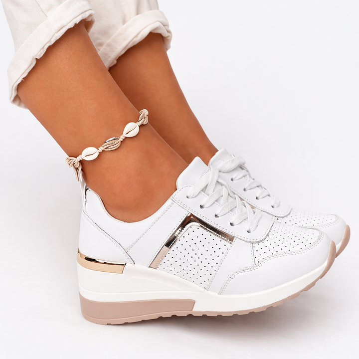 Supportive lace-up wedge trainers for women, offering all-day comfort & foot health.