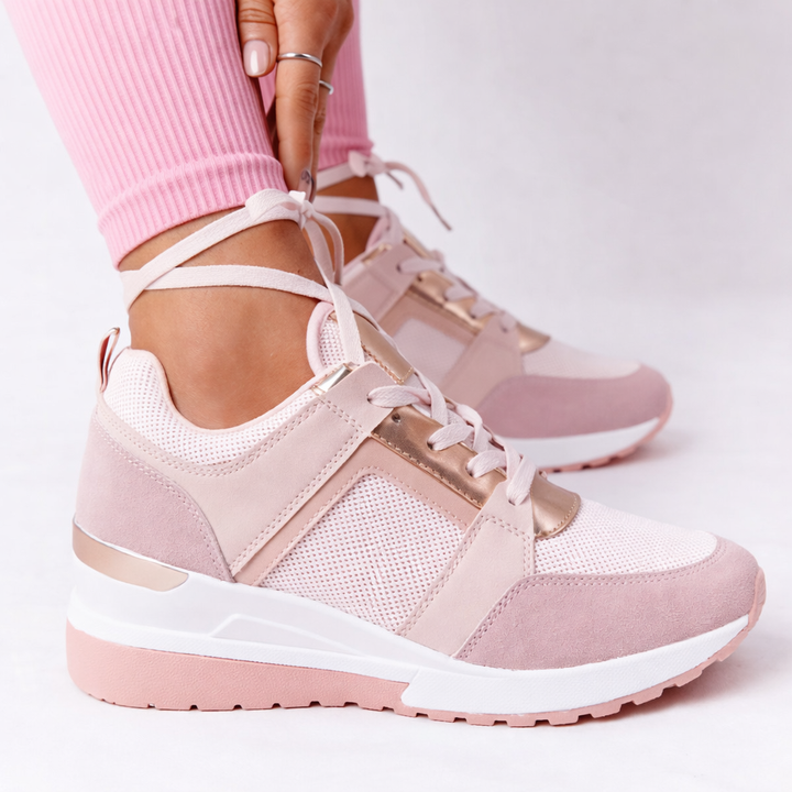 Breathable women's wedge sneakers in a stylish casual design, ideal for everyday comfort.