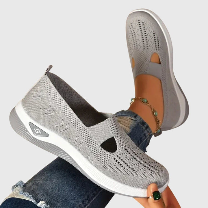 Close-up of women's supportive walking shoes, highlighting cushioned sole & comfortable fit.