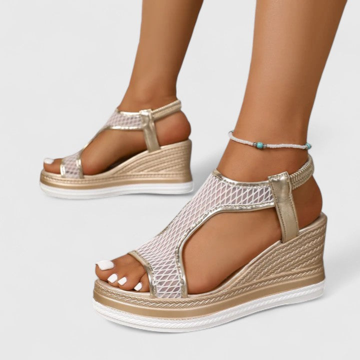 Supportive and comfortable women's sandals, featuring a stylish wedge and arch support.