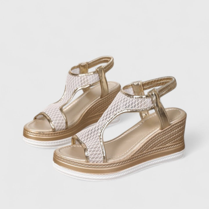 Orthopaedic women's sandals featuring a stylish wedge and robust arch support for healthy feet.