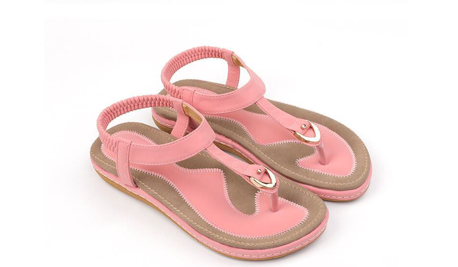 Versatile women's T-strap flat sandals with an elastic strap for easy on/off and summer casual style.