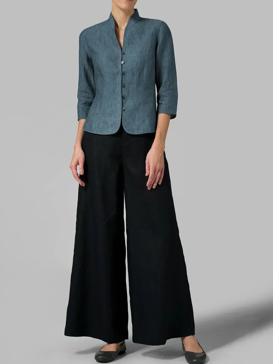 Versatile women's 3/4 sleeve jacket with mandarin collar. Ideal for summer layering or fall. Chic button-front style.