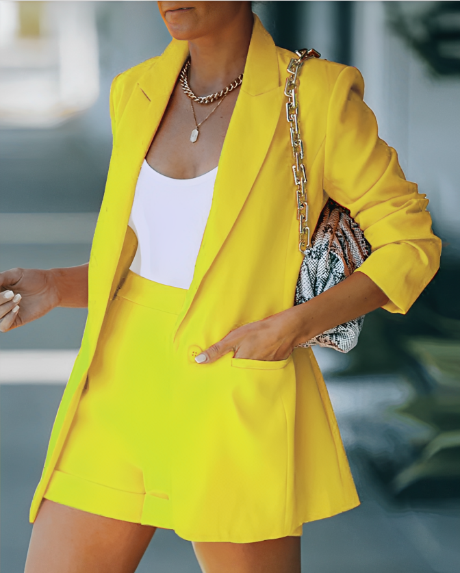 Chic summer fashion: women's smart casual blazer and shorts set.