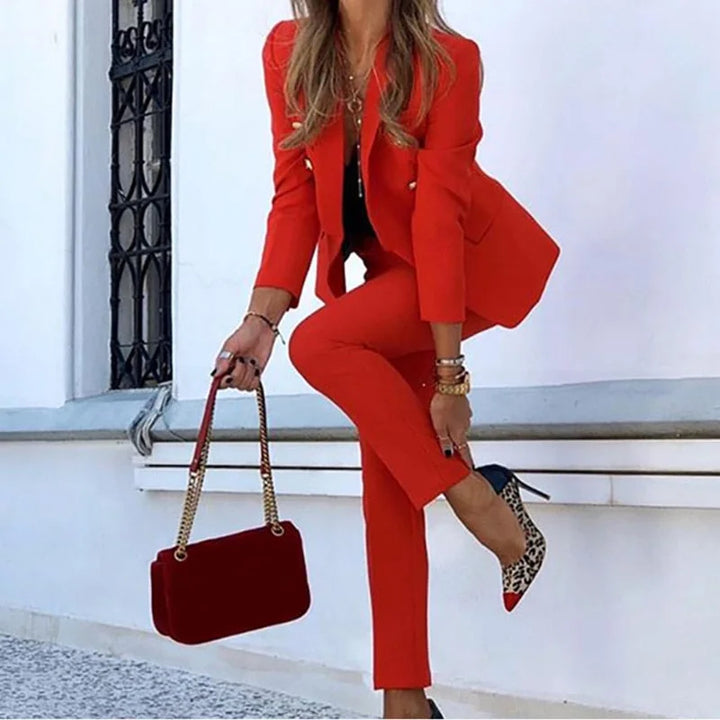 Elegant women's power suit: tailored blazer & trousers set. Ideal for professional business attire & chic formal occasions.