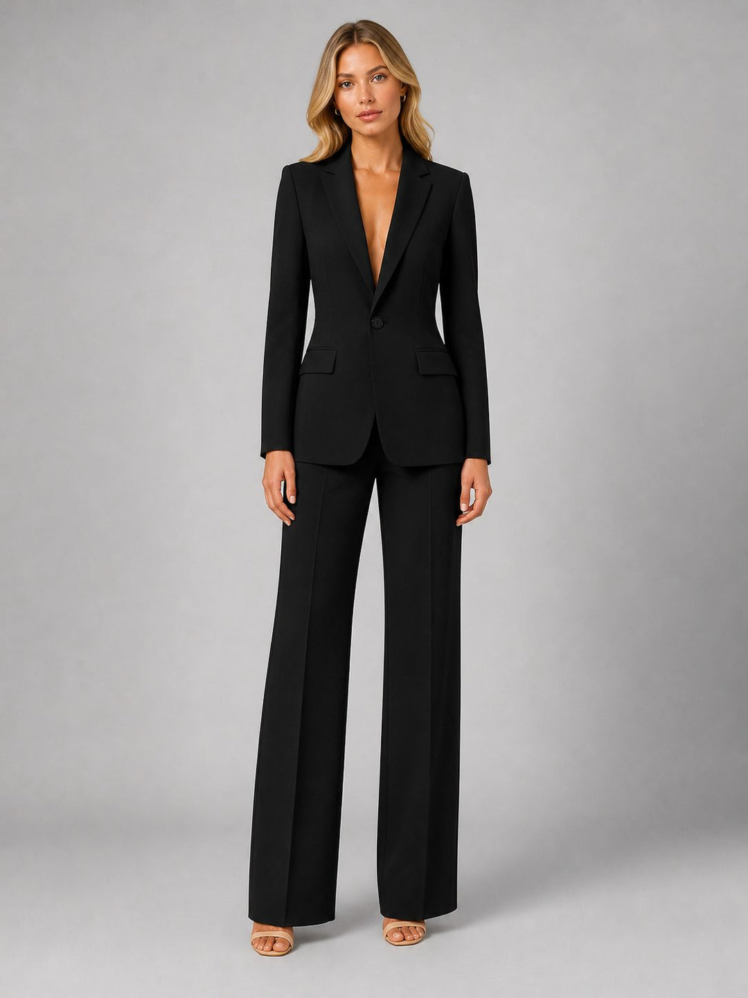 Elegant women's tailored suit with blazer & wide leg trousers. Versatile for business or smart casual.