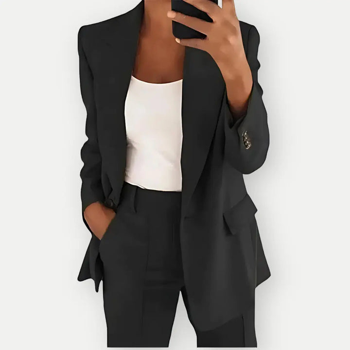 Chic women's power suit, a tailored blazer and matching trousers for a sophisticated professional look.