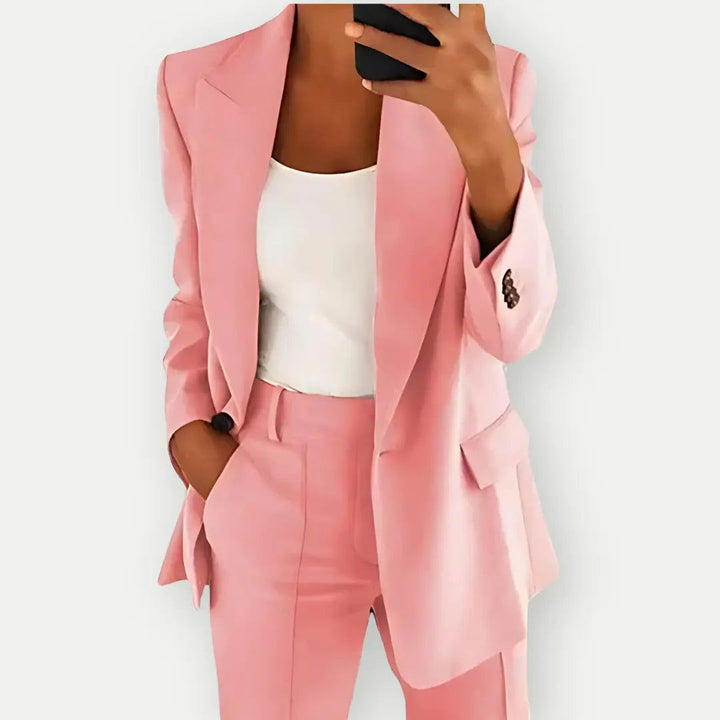 Professional women's suit, featuring a stylish blazer and coordinating trousers, ideal for business wear.
