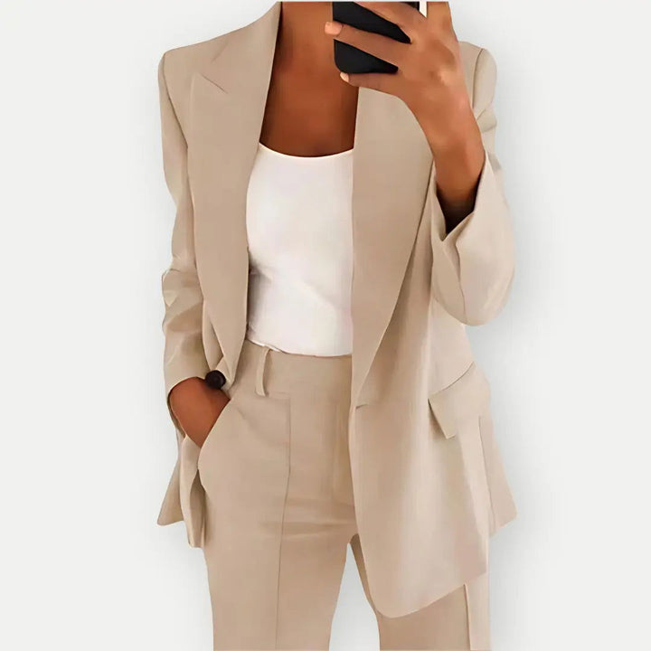 Elegant women's tailored ensemble, a smart blazer and trousers for a polished and chic work outfit.