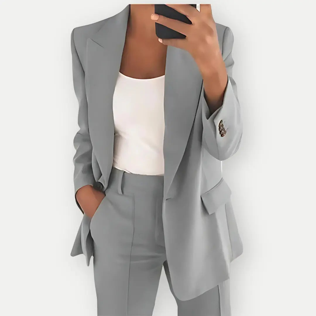Modern women's business attire, a sleek blazer and fitted trouser set for a commanding professional style.