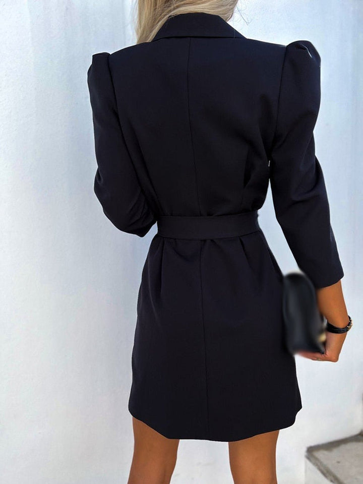Modern women's double-breasted blazer dress, tailored fit with a belted waist, perfect for elegant formal or party wear.