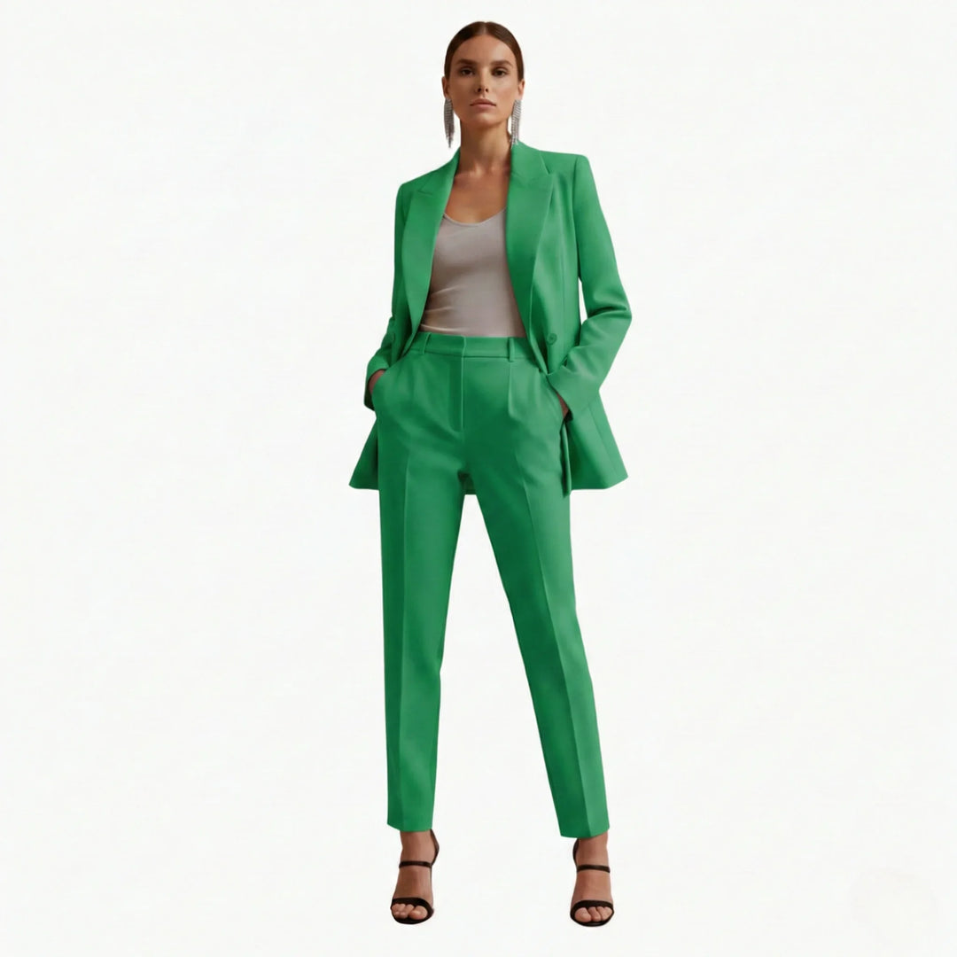 Modern women's double-breasted blazer and trousers set. Tailored for a professional and elegant look.
